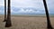 Beach with overcast skyand thick white clouds