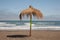  beach in the pacific ocean on  sunny day and  rustic  umbrella in the middle of