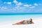 Beach paradise getaway bikini woman tanning