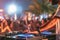 Beach Party Extravaganza: DJ Mixing Igniting the Summer Nightlife with Energetic Crowd and Vibrant Disco Vibes. created with