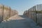 Beach path in sand dune beach. Wooden beach path with wooden fences.