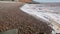 Beach with pebbles and waves low down view