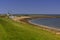 Beach with pier, sailboats and mudflats