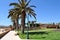 A beach and promenade with palm trees and cacti in Fuerteventura,Canary islands