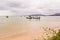 Beach on rainy season with some local fishing boats