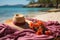 Beach ready with hat towel and a cool drink, summer landscape image