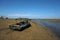 Beach when recede with object wooden fishing boat.