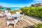 Beach restaurant on Famous La Pelosa beach on sunny summer day