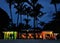 Beach restaurant under the palm trees in the evening, Mauritius