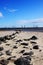 Beach with rocks leading into water