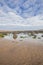 Beach with rocks in the sand at Cayton Bay, UK