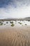 Beach with rocks in the sand at Cayton Bay, UK