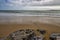 The Beach, Rocks, Sand, Waves And Clouds of South Beach, Tenby, Pembrokeshire, Wales, UK.