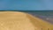 Beach, with rocks, waves and vegetation forming a beautiful maritime landscape.