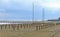 Beach with rows of umbrella stands