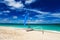 Beach, sailboat and tropical sea