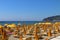 .The beach of San Bartolomeo al Mare with the promontory of Capo Berta in the background.. Imperia-Italy