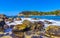 Beach sand blue turquoise water waves rocks panorama Puerto Escondido