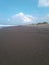 the beach sand is clean and half full of garbage