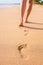 Beach sand footprints woman feet walking barefoot
