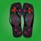 Beach sandals, black flip flops with a bright pattern on green b