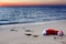 The beach with Santa Claus hat at sunset