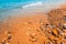 Beach scene, rocks and small waves, tranquil landscape of the coast