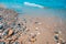 Beach scene, rocks and small waves, tranquil landscape of the coast