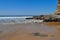 Beach scene, rocks, surf, sea and horizon