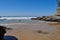 Beach scene, rocks, surf, sea and horizon