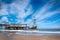 The beach of Scheveningen overlooking the old pier with bungy-tower