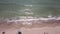 Beach and sea aerial top view. shore soft waves and pebbles in the sea.