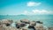 Beach and sea with blue sky and reef rock beach