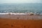 Beach,sea,fishing boat in the distance