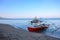 Beach and sea landscape with traditional filipino wooden boat. Morning sunrise on tropical island seashore