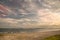 A beach on the sea, sand and waves, seagulls fly over the water.