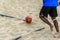 A beach soccer player ready to take a corner