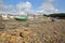 The beach Solidor at Saint Servan at low tide with Sainte Croix Church in the background and colorful boats in the foreground, Sai