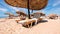 Beach straw women hats awnings umbrellas blue sky wooden tables sun loungers Mediterranean Sea tropical nature resort mount Olympu