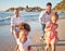 Beach, summer and travel with family running on sand in Mexico for vacation fun with kids. Happy mother and father bond