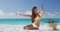 Beach summer vacation - bikini woman taking phone selfie sun tanning