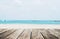 The Beach in Summer, wooden terrace with defocused tropical beach