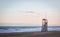 Beach sunrise with vintage lifeguard wood tower