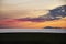 Beach sunset with crimson clouds