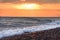 Beach sunset with endless horizon and incredible foamy waves. Sunrise sea baclground.