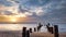 Beach Sunset with fisherboat and a crumpled pier