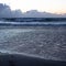 The beach at the sunset with the human footprints on the sand - Image