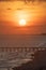 Beach sunset Panama City Beach, Florida with pier and people