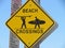 Beach surfer crossing sign