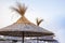 Beach thatched umbrellas on the beach promenade.